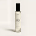 seelct sample vial of Bade'e Al Oud Oud for Glory by Lattafa, oud fragrance, on bone background